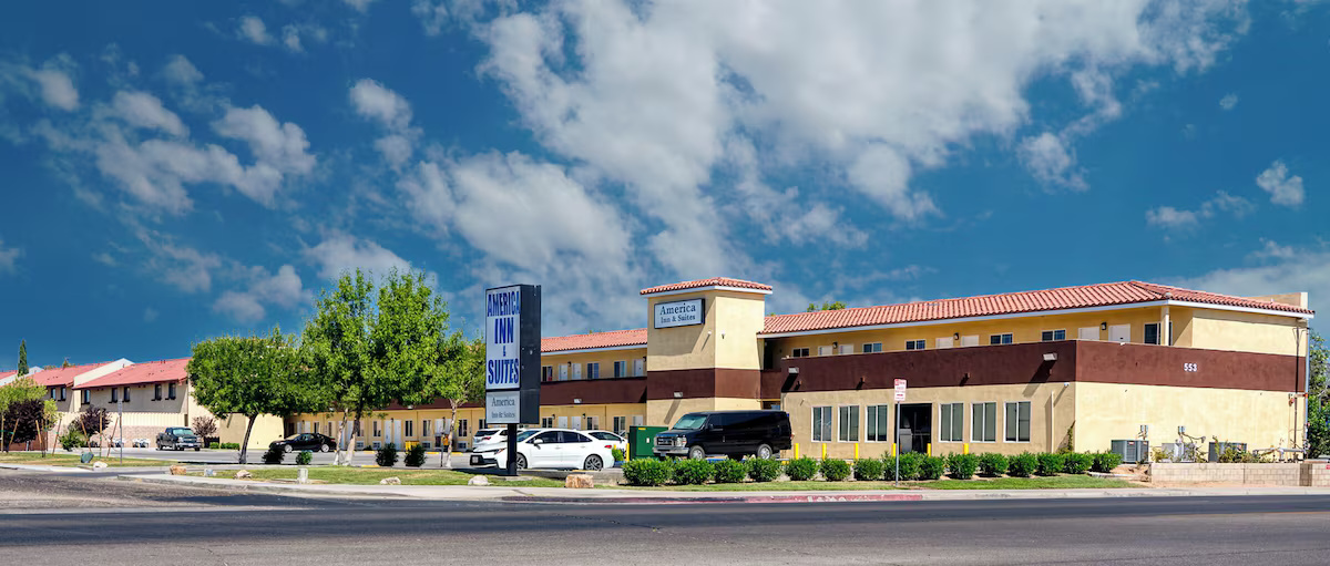 America Inn & Suites exterior with hotel sign
